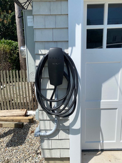 Black Tesla charging station